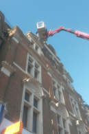 Installing Bird Spikes at the top of the building